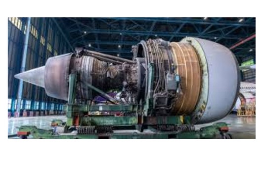 A green cup of a coffee on a wooden table